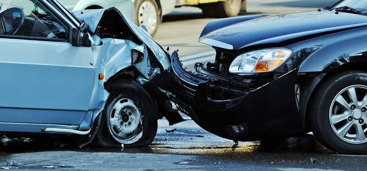 head-on collision between black car and gray car