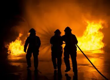 Firefighters putting out a fire that resulted in a victim with a burn injury case
