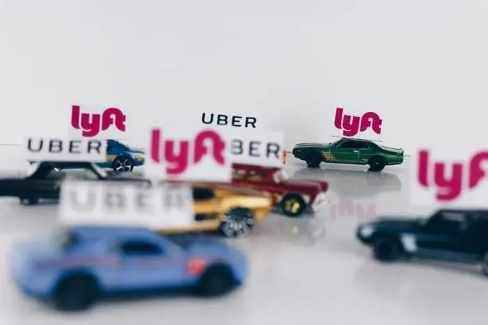 hotwheel cars with varying uber and lyft rideshare signs