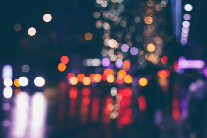 blurred brake lights on street at night