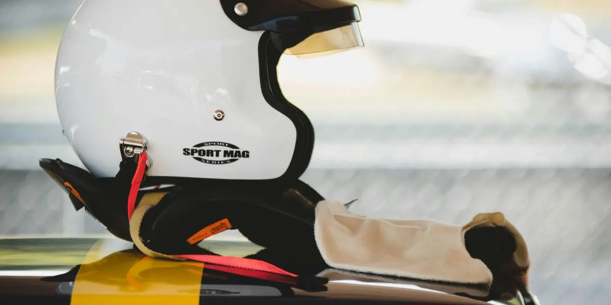white racing helmet on top of racecar