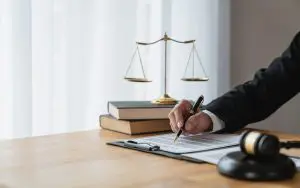 female legal advisor or lawyer writing with a pen