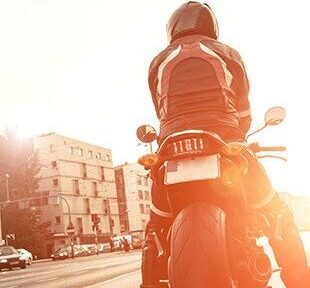 motorcycle rider on motorcycle stopped at stoplight
