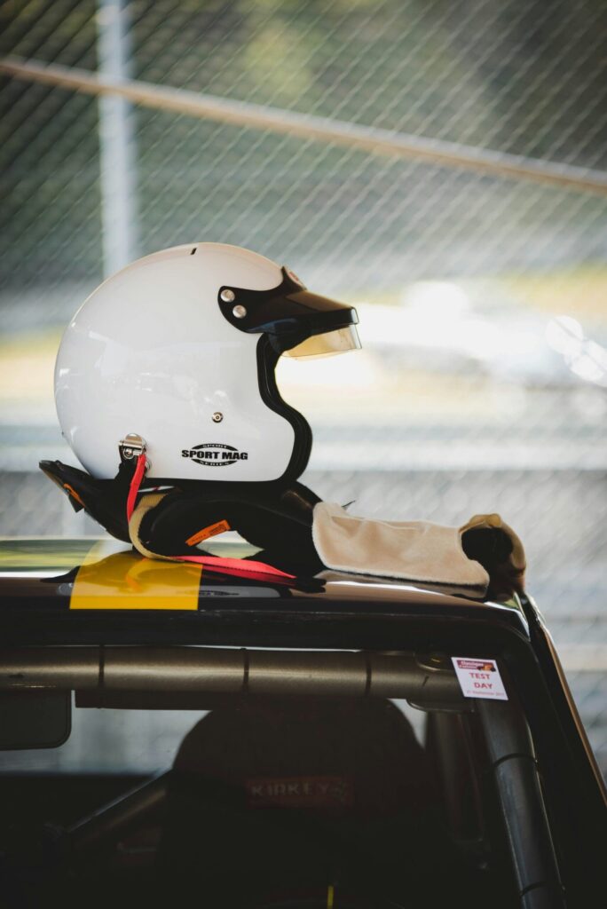 white racing helmet on top of racecar