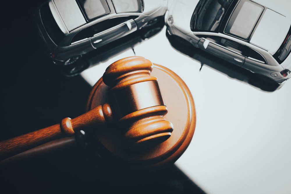 Accident lawsuit with car and court gavel